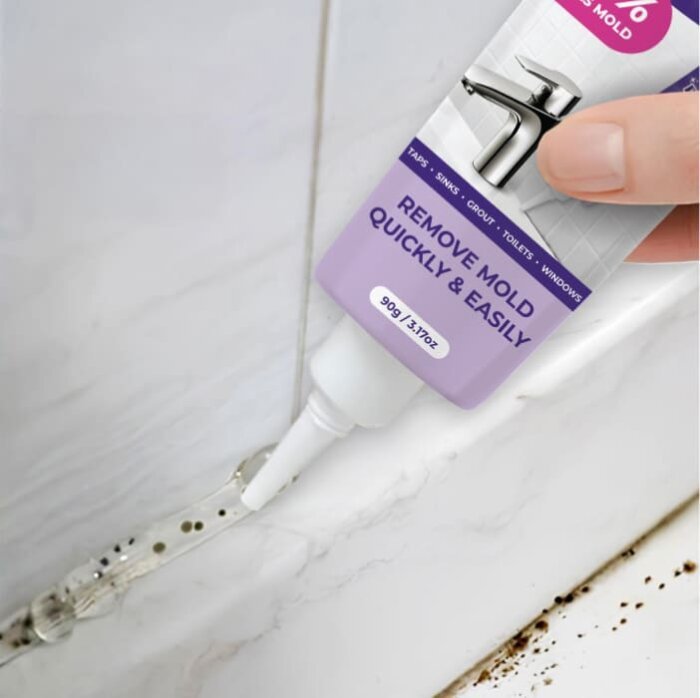 Application of NuroClean mold remover gel on bathroom tile grout with black mold stains.